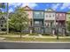 Colorful townhomes with manicured lawns and sidewalks create inviting curb appeal at 2016 Bixby Byway Se Dr, Atlanta, GA 30317