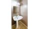 This bathroom has a traditional pedestal sink with a mirror and updated light fixture at 3396 Misty Harbour Trl, Doraville, GA 30340