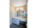The bathroom features a sink, a large mirror, and a light fixture above, offering functionality and a clean aesthetic at 3396 Misty Harbour Trl, Doraville, GA 30340