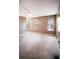 Large bedroom with three windows, plush carpet, and a ceiling fan at 3396 Misty Harbour Trl, Doraville, GA 30340