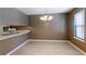 Inviting dining space with updated lighting, neutral tones, and convenient kitchen access at 3396 Misty Harbour Trl, Doraville, GA 30340