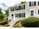 Inviting townhome with a classic design, featuring a front porch and well-maintained landscaping at 3396 Misty Harbour Trl, Doraville, GA 30340