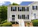 Charming two-story home with a welcoming front porch, neat landscaping, and classic curb appeal at 3396 Misty Harbour Trl, Doraville, GA 30340