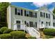 Charming townhome with a welcoming front porch, manicured landscaping, and classic shutters at 3396 Misty Harbour Trl, Doraville, GA 30340