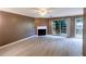Spacious living room featuring a fireplace, and access to the outdoor patio at 3396 Misty Harbour Trl, Doraville, GA 30340