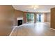 Bright living room featuring a fireplace, neutral paint, and access to the outdoor patio at 3396 Misty Harbour Trl, Doraville, GA 30340