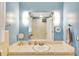Bright bathroom with a marble countertop and a large, well-lit mirror at 3914 Granger Dr, Atlanta, GA 30341