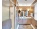 Well-lit bathroom features a tiled shower, vanity, and vintage-style fixtures at 3914 Granger Dr, Atlanta, GA 30341