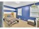 Charming bedroom with blue walls, striped accents, and a cozy, well-lit atmosphere at 3914 Granger Dr, Atlanta, GA 30341