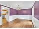 Stylish dining room featuring hardwood floors, wainscoting, and a chandelier, perfect for Gathering gatherings at 3914 Granger Dr, Atlanta, GA 30341