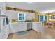 Bright kitchen with white cabinets, stainless steel appliances, and a cozy dining area with ample natural light at 3914 Granger Dr, Atlanta, GA 30341