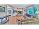 Inviting living room featuring a brick fireplace, built-in shelving, and large windows offering natural light at 3914 Granger Dr, Atlanta, GA 30341