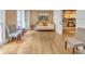 Cozy living room with hardwood floors, a brick fireplace, built-in bookshelves, and comfortable seating at 3914 Granger Dr, Atlanta, GA 30341