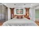 Large main bedroom boasts a picture and plush pillows creating a relaxing retreat at 3914 Granger Dr, Atlanta, GA 30341