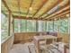 Charming covered patio with wood flooring, perfect for outdoor dining and relaxation at 3914 Granger Dr, Atlanta, GA 30341