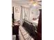Comfortable bedroom with a cozy bed, ceiling fan, wood floors and tasteful decor, perfect for restful nights at 791 Bristol Way, Lithonia, GA 30058