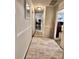 The hallway features a neutral color palette, creating a seamless transition between living spaces at 791 Bristol Way, Lithonia, GA 30058