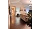 Cozy living room featuring modern decor and seamless flow to the entryway, creating a warm and inviting space at 791 Bristol Way, Lithonia, GA 30058