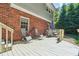 Relaxing back deck with outdoor seating and a brick exterior at 190 Windflower Trce, Roswell, GA 30075