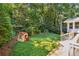 Lush backyard with a playhouse and swingset at 190 Windflower Trce, Roswell, GA 30075