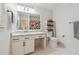 Clean bathroom features white vanity, white hexagon tile floor, and shower with floral shower curtain at 190 Windflower Trce, Roswell, GA 30075