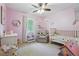 Cozy bedroom with a crib, soft carpet, neutral colors, and natural light at 190 Windflower Trce, Roswell, GA 30075