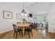 Open floor plan featuring a dining area with pendant lighting connecting to the living room at 190 Windflower Trce, Roswell, GA 30075