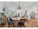 Open floor plan with the dining area leading to the living room and kitchen at 190 Windflower Trce, Roswell, GA 30075