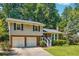 Beautiful two-story home with an attached two-car garage, mature trees, and well-kept landscaping at 190 Windflower Trce, Roswell, GA 30075