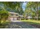 Attractive split-level home with mature trees, a two-car garage, and well-maintained lawn at 190 Windflower Trce, Roswell, GA 30075