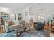 Spacious living room with hardwood floors that leads to the kitchen and a cozy seating area at 190 Windflower Trce, Roswell, GA 30075