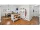 Open floor plan with dining area, kitchen bar, and front door entrance at 190 Windflower Trce, Roswell, GA 30075
