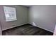 Cozy bedroom featuring neutral paint, plush carpeting, and a window offering natural light at 3900 Ferncliff Rd, Snellville, GA 30039