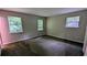 Sunny bedroom with plush carpeting, neutral walls, and well-lit windows at 3900 Ferncliff Rd, Snellville, GA 30039