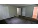 Neutral bedroom featuring plush carpet, ample closet space, and access to bathroom at 3900 Ferncliff Rd, Snellville, GA 30039