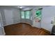 Bright dining area with hardwood floors, bay windows, and access to the deck at 3900 Ferncliff Rd, Snellville, GA 30039