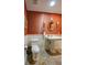 Half bathroom featuring stone floors, pedestal sink and traditional fixtures at 470 Ansley Walk Ne Ter, Atlanta, GA 30309