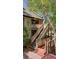 Exterior staircase leading to upper level with brick pathway and lush greenery at 470 Ansley Walk Ne Ter, Atlanta, GA 30309