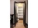Bright walk-in pantry features adjustable white shelving, bifold doors, tile flooring, and washer/dryer hookups at 470 Ansley Walk Ne Ter, Atlanta, GA 30309