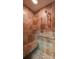 Luxurious walk-in shower featuring stone tile, seat, and hand-held shower head at 470 Ansley Walk Ne Ter, Atlanta, GA 30309