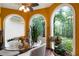 Charming breakfast nook with arched windows offering picturesque views of the surrounding nature at 790 Friendship Church Rd, Douglasville, GA 30134