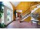 Bright foyer with tile floors, a staircase, and decorative glass door, offering a warm welcome at 790 Friendship Church Rd, Douglasville, GA 30134