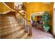 Grand foyer showcasing a beautiful wooden staircase, tile flooring, and open floor plan at 790 Friendship Church Rd, Douglasville, GA 30134
