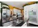 Modern kitchen with stainless steel appliances, granite countertops, and custom cabinetry offers functionality at 790 Friendship Church Rd, Douglasville, GA 30134