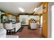 Bright kitchen with stainless appliances, tile floors, white cabinets, and a center island at 790 Friendship Church Rd, Douglasville, GA 30134