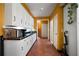 Bright kitchen featuring white cabinets, black countertops and tile flooring at 790 Friendship Church Rd, Douglasville, GA 30134
