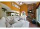 Open-concept living room with a stone fireplace, large windows, and tile flooring at 790 Friendship Church Rd, Douglasville, GA 30134