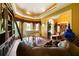 Comfortable living room with a piano, bookshelves, and tile floors at 790 Friendship Church Rd, Douglasville, GA 30134