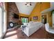 Bright living room with a stone fireplace, tile floors, and an abundance of natural light at 790 Friendship Church Rd, Douglasville, GA 30134