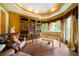 Elegant living room featuring a piano, custom built-ins, and ample natural light at 790 Friendship Church Rd, Douglasville, GA 30134